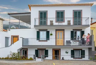 a building with people on the balconies at Casa de Sao Tiago 2 in Funchal
