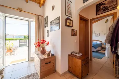 a living room with a door leading to a bedroom at Bliss Villa in Aljezur