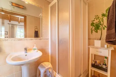 a bathroom with a sink and a shower at Bliss Villa in Aljezur