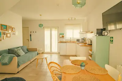 a living room with a couch and a table at Wayra Lodge [Kanchay] in Raposeira