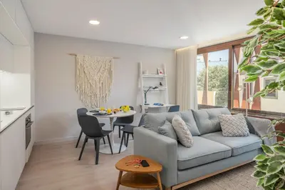 a living room with a couch and a table at Cine Park Residences by An Island Apart in Funchal