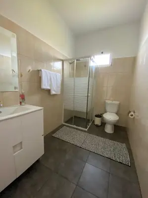 a bedroom with a bed and a large window at Country house in Arco da Calheta