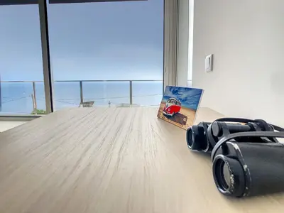 a camera and a book on a table in a room at Villa Omar by LovelyStay in Canhas