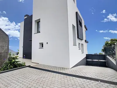 a white building on a balcony with a tile floor at Villa Omar by LovelyStay in Canhas