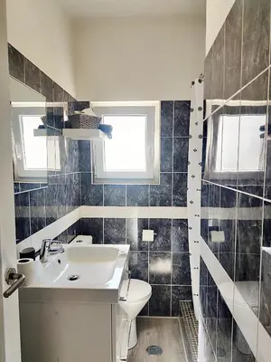 a bathroom with a sink and a toilet at Caroline's in Vila do Bispo