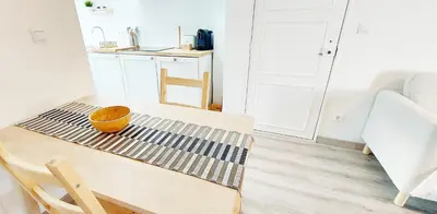 a kitchen with a table with a bowl on it at Caroline's in Vila do Bispo