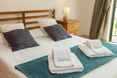 a bedroom with two towels on a bed at B73 - Luz Sun Holiday Apartment in Lagos