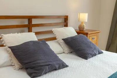 a bedroom with a bed with two pillows on it at B73 - Luz Sun Holiday Apartment in Lagos