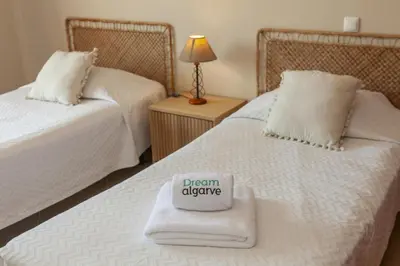 a bedroom with two beds with a sign on at B73 - Luz Sun Holiday Apartment in Lagos