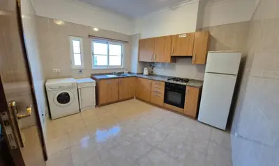 a kitchen with a white refrigerator and a dishwasher at Jay Paradise in Santa Cruz