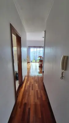 an empty room with a hallway with wood floors at Jay Paradise in Santa Cruz