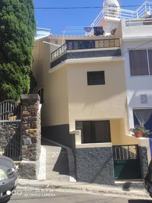 a house with a balcony on the side of it at Casa Bica do Cais - By the Sea in Paul do Mar