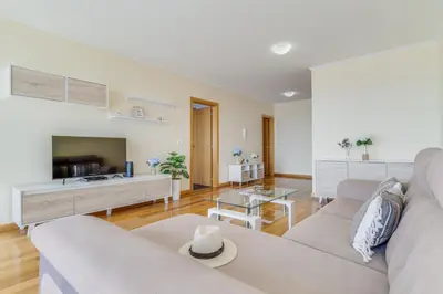 a living room with a couch and a tv at Casa Morena by Atlantic Holiday in Santa Cruz
