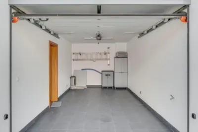 an empty garage with white walls and a tile floor at Casa Morena by Atlantic Holiday in Santa Cruz