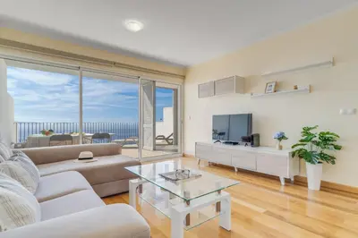 a living room with a couch and a table at Casa Morena by Atlantic Holiday in Santa Cruz