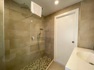 a bathroom with a shower and a sink at Estúdio com Fantástica Vista Mar - Praia da Luz in Luz