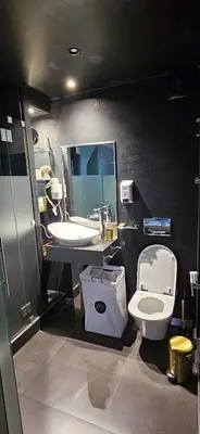 a bathroom with a toilet and a sink at A Cornes Of The Atlantic in Funchal