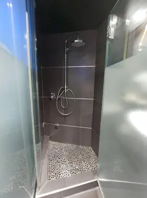a shower with a glass door in a bathroom at A Cornes Of The Atlantic in Funchal