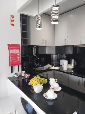 a kitchen with a table with fruit on it at A Cornes Of The Atlantic in Funchal