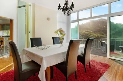 a dining room with a white table and chairs at Madeira Villa Liliana in Campanário