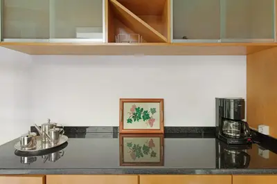 a kitchen with a counter top with a coffee maker at Madeira Villa Liliana in Campanário