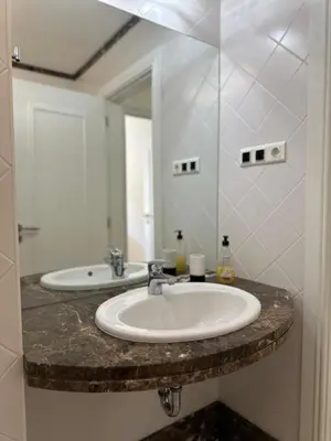 a bathroom with two sinks and a mirror at Luxury Sea View Apartment in Funchal