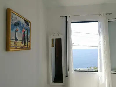 a bathroom with a sink and a toilet at Westerland House in Ribeira Brava