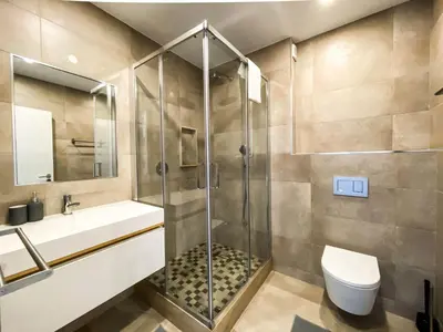 a bathroom with a shower and a toilet and a sink at 1Bed Apartment Amazing Sea View in Luz