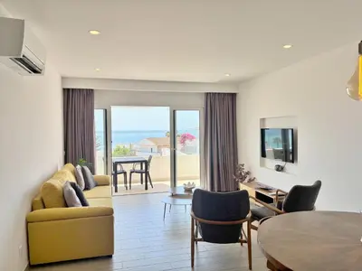 a living room with a couch and a table at 1Bed Apartment Amazing Sea View in Luz