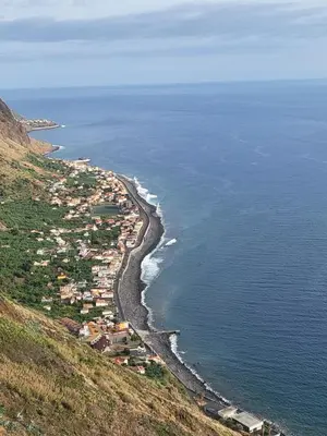 an aerial view of a town on a hill next to the ocean at Villa Paradise Madeira Ocean View in Fajã da Ovelha