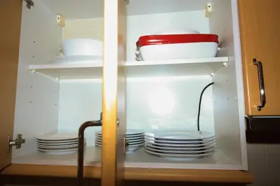 a cupboard with plates and dishes in it at Casa Do Pico by AnaLodges in Machico