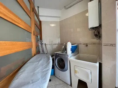 a small laundry room with a washer and dryer at Casa Do Pico by AnaLodges in Machico