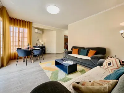 a living room with a couch and a table at Casa Do Pico by AnaLodges in Machico