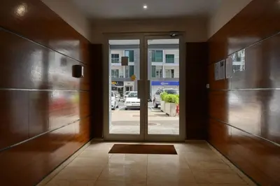 an entrance to a building with a glass door at Forum Escape, a Home in Madeira in Funchal
