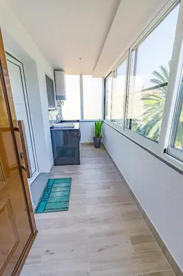 a hallway of a house with large windows at Vista Oceano III in Caniço