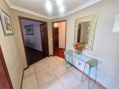 a hallway with a glass table and a mirror at Alex Apartment by Mth in Funchal