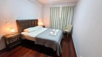 a bedroom with a bed and a chair and a window at Alex Apartment by Mth in Funchal