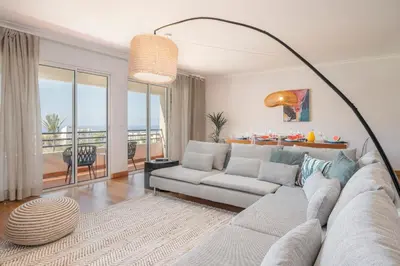 a living room with a couch and a table at Monumental Place by An Island Apart in Funchal
