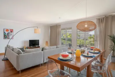 a living room with a table and a couch at Monumental Place by An Island Apart in Funchal