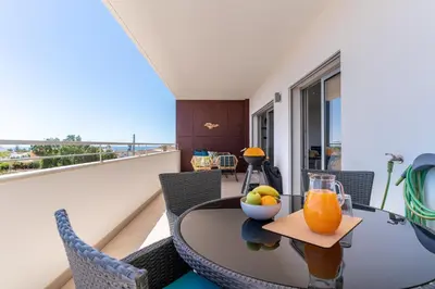 a dining room with a table with a bowl of fruit at Spacious 2 bedroom Apartment with Sea View Lagos by Lisbeyond in Lagos