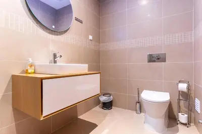 a bathroom with a shower and a sink at Spacious 2 bedroom Apartment with Sea View Lagos by Lisbeyond in Lagos