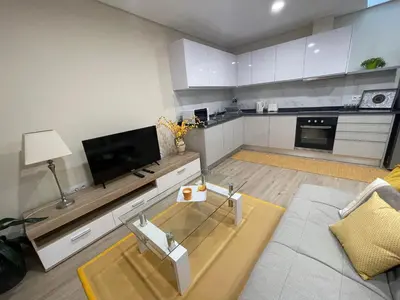 a living room with a flat screen tv and a couch at Beautiful View 1 - Arco da Calheta - Ilha da Madeira in Arco da Calheta