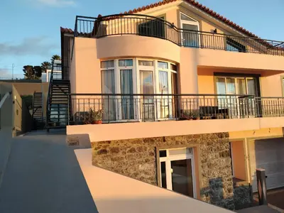 a large house with a balcony on the side at Beautiful View 1 - Arco da Calheta - Ilha da Madeira in Arco da Calheta