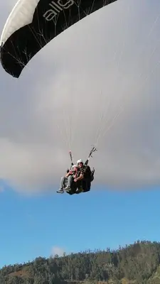 a group of people flying through the air with a parachute at Beautiful View 1 - Arco da Calheta - Ilha da Madeira in Arco da Calheta