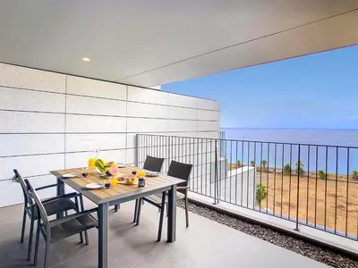 a table and chairs on a balcony with a view of the ocean at The Best Sea View Apartment by LovelyStay in Funchal