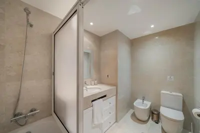 a bathroom with a toilet and a sink and a shower at Santa Luzia II by An Island Apart in Funchal