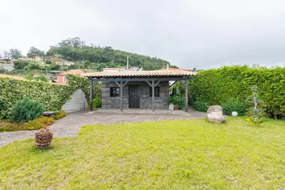 a house with a yard with a building at Villa Valeriu in Santa Cruz