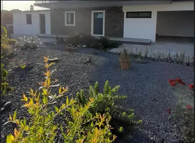 a garden in front of a house at Casa Magic Vieira New well located with services in Arco da Calheta