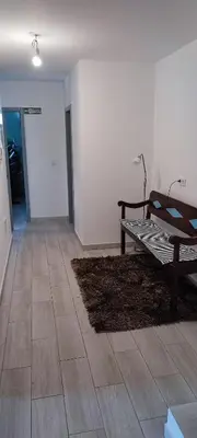a living room with a bench on a floor at Casa Magic Vieira New well located with services in Arco da Calheta