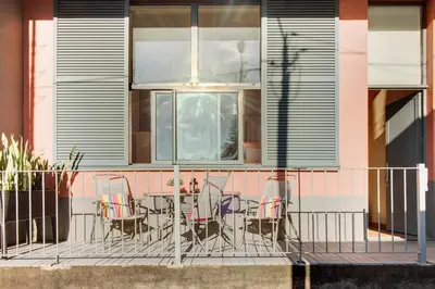 a patio with chairs and a table on a building at Calheta Lofts I in Calheta